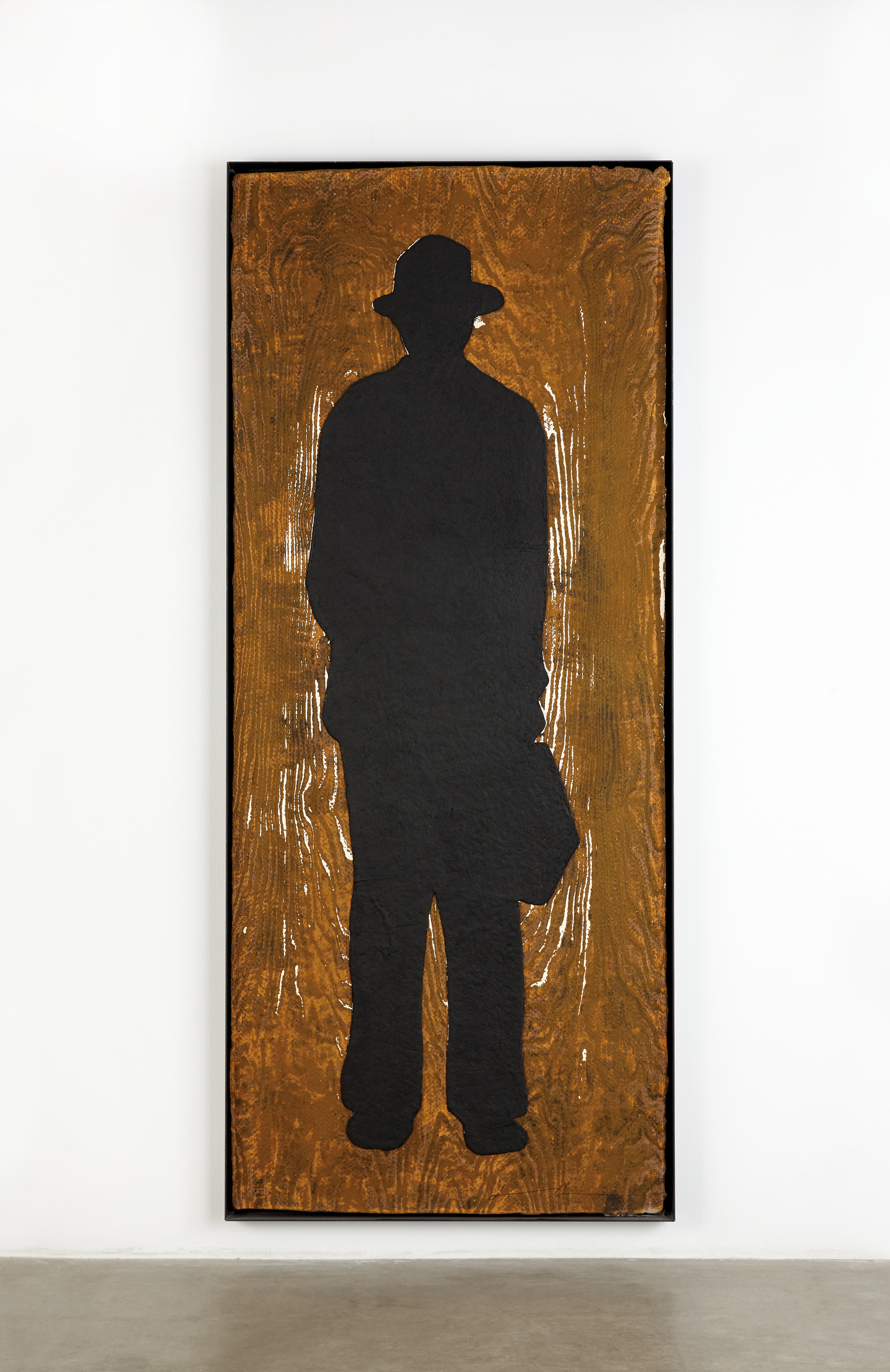 Jonathan Borofsky's Man with Briefcase (C), a woodcut with collage on handmade paper.
