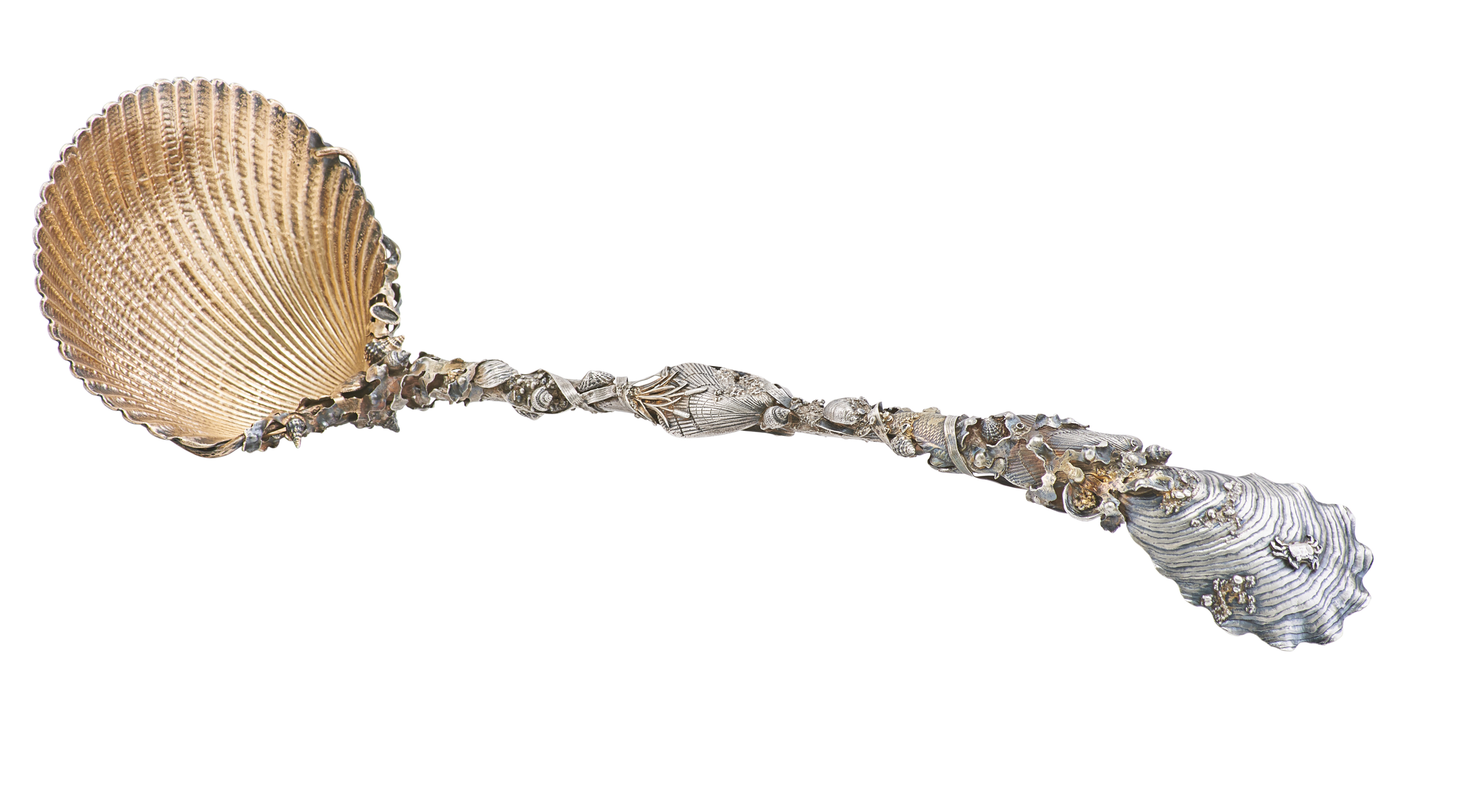 This circa 1880s parcel gilt sterling silver punch ladle in the Narragansett pattern by Gorham has a shell-shaped spoon that truly resembles a cockle shell. The interior of the spoon is gold. The stem of the ladle is festooned with with seaweed, fish, and grains of sand. The top of the handle resembles an oyster shell.