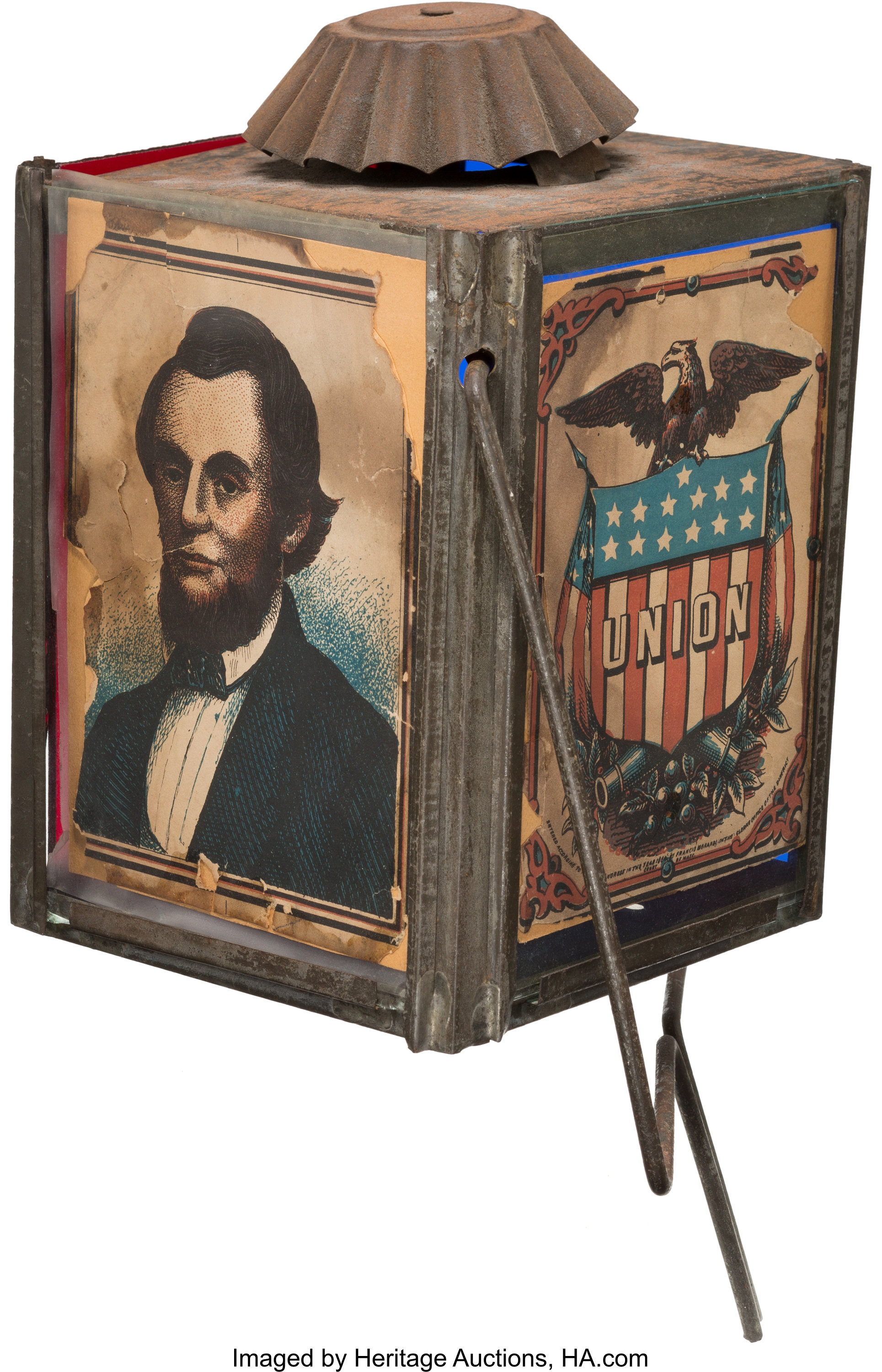 This rare circa 1860s parade lantern features an image of Abraham Lincoln on one panel and a spread-winged eagle sitting on a shield with the word "union" on it.