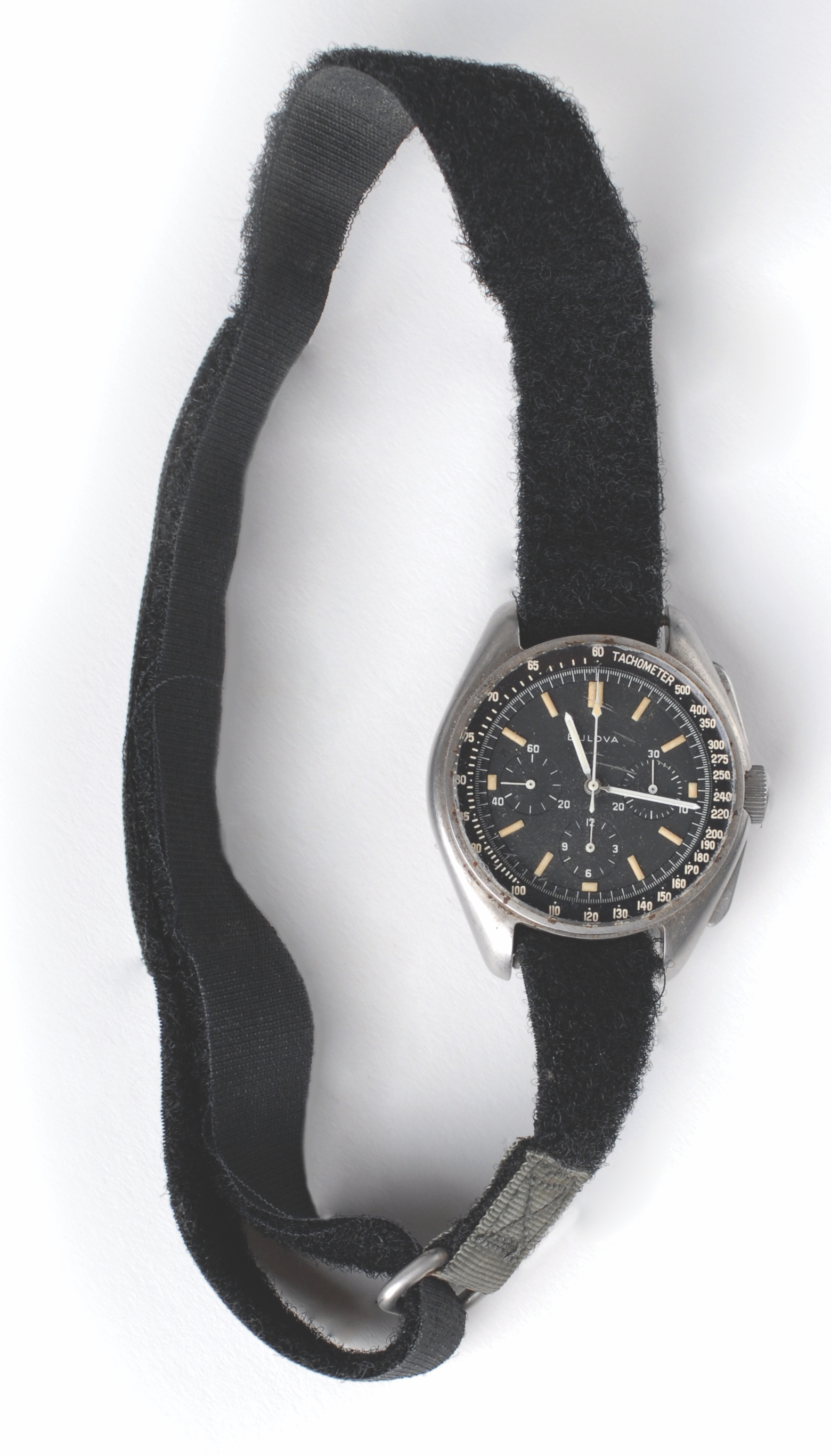 The Bulova chronograph that astronaut David Scott wore on the surface of the moon during the Apollo 15 mission, shown in full, with the fuzzy side of the velcro strap visible.