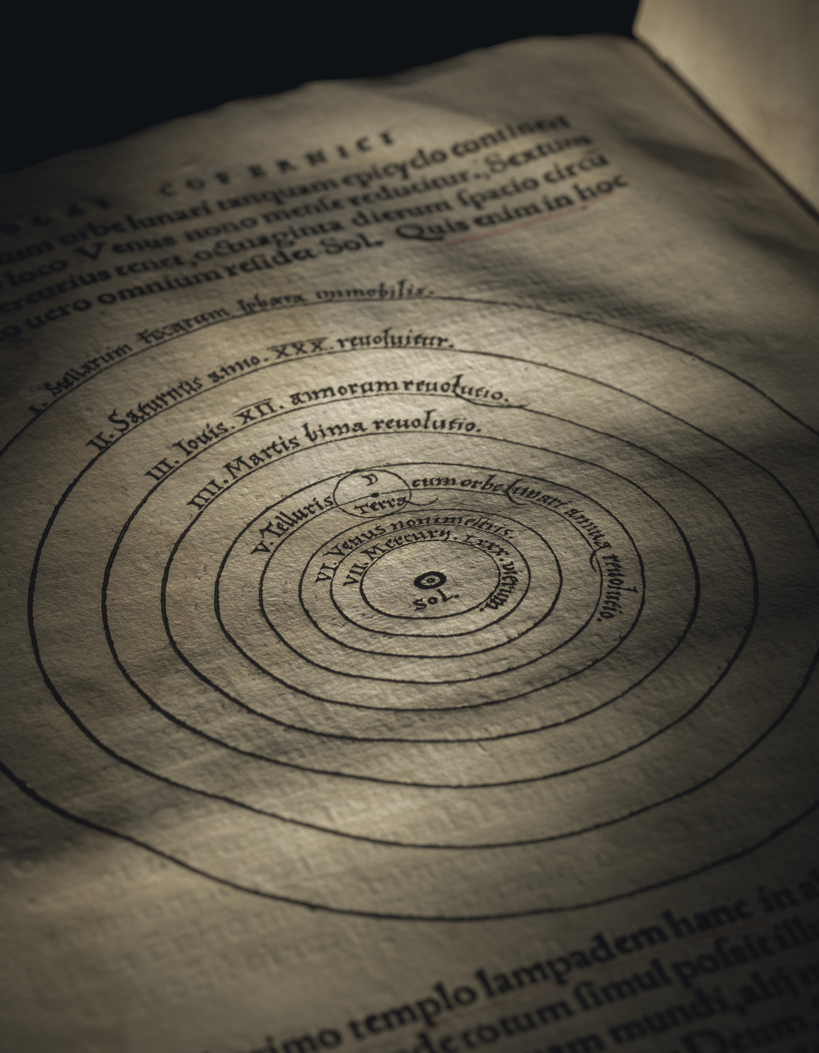 The 1543 Copernicus, open to the page showing the woodcut illustration that places the sun at the center of everything, rather than the earth.